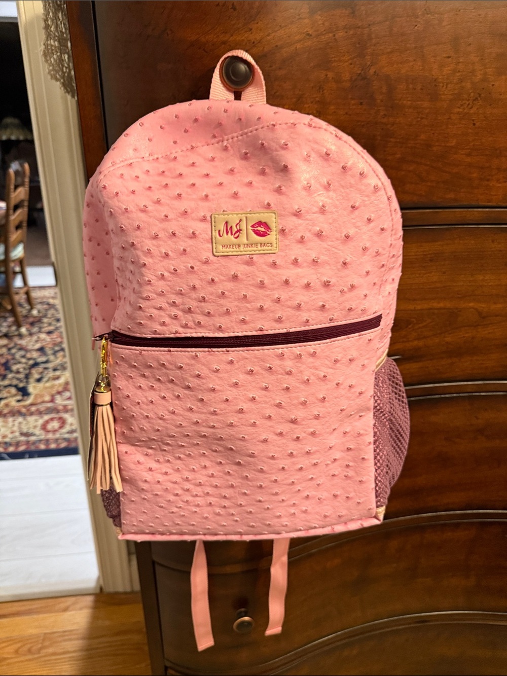 Makeup Junkie backpack in pink ostrich.